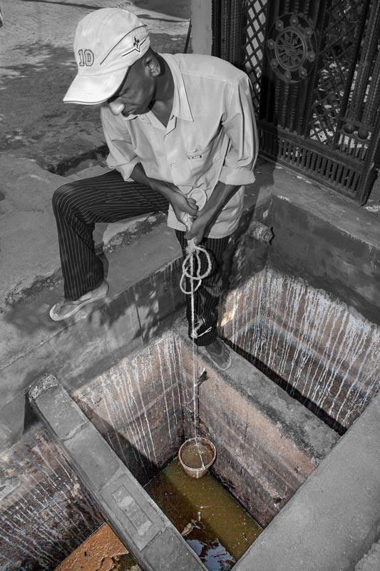 Effluent being manually drawn from a septic tank in a peri-urban house in Bareilly city, Uttar Pradesh